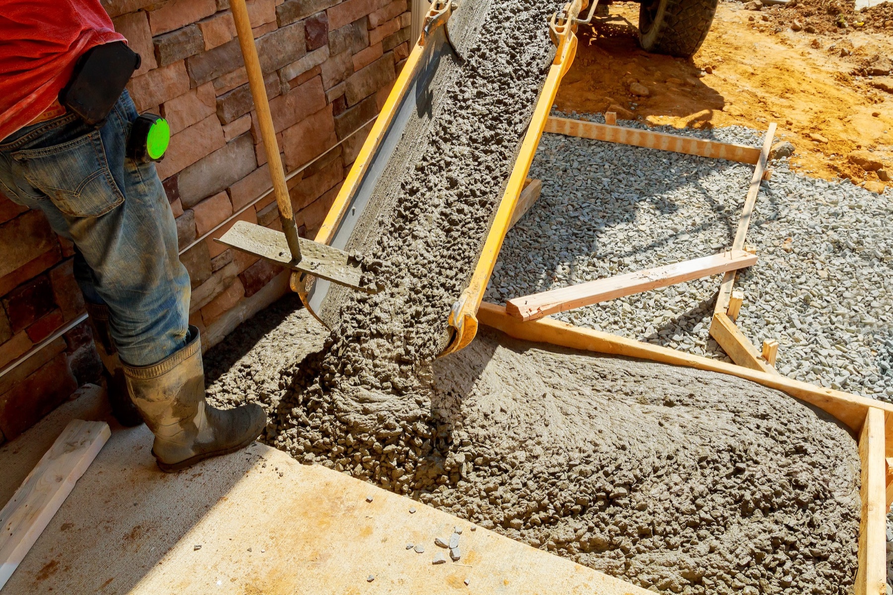 Fresh concrete being poured into forms