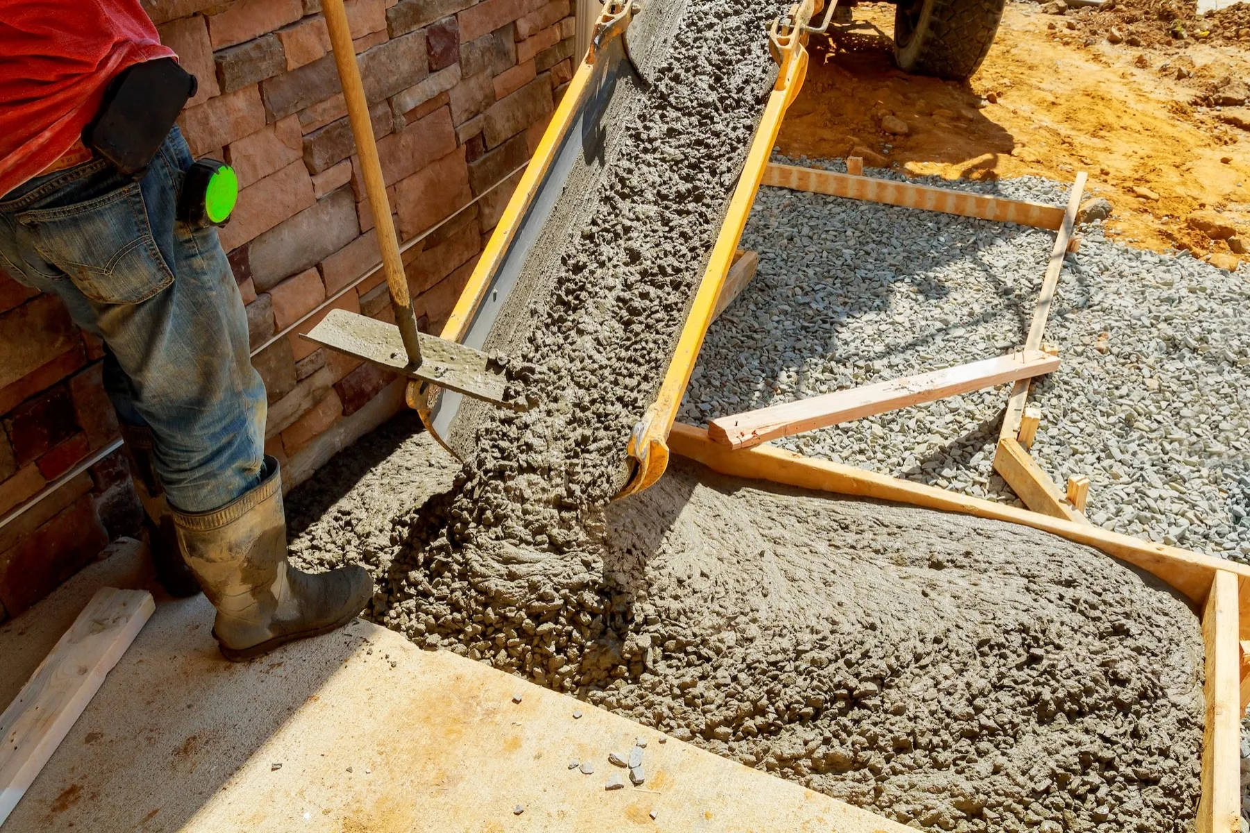 Fresh concrete being poured into forms
